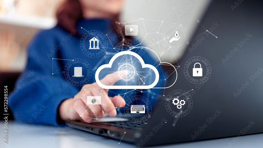 Woman uploading and transferring data from computer to cloud computing. Digital technology concept, data sheet management with large database capacity and high security.